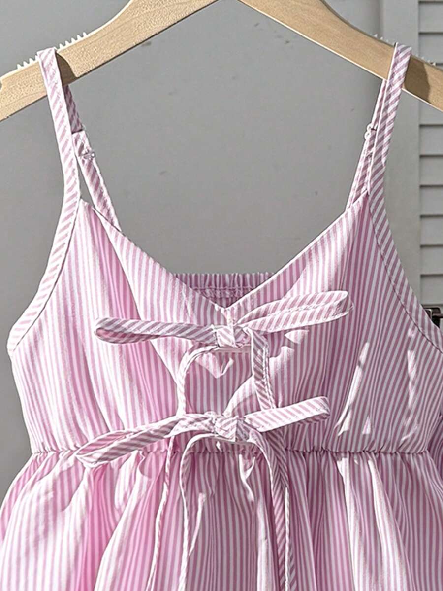 Tween girl 2-piece summer set with a black and white sleeveless striped spaghetti strap tank top with ruffle details and matching casual shorts.