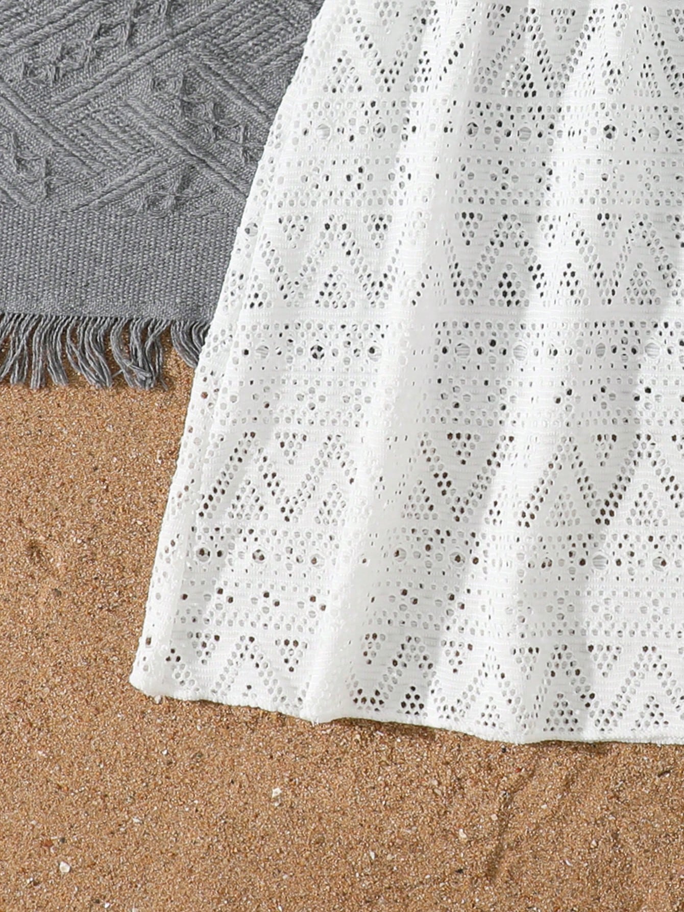 White tween girls swimsuit cover-up with V neck, short sleeves, contrast lace, fringe details, and regular length mesh fabric for beachwear