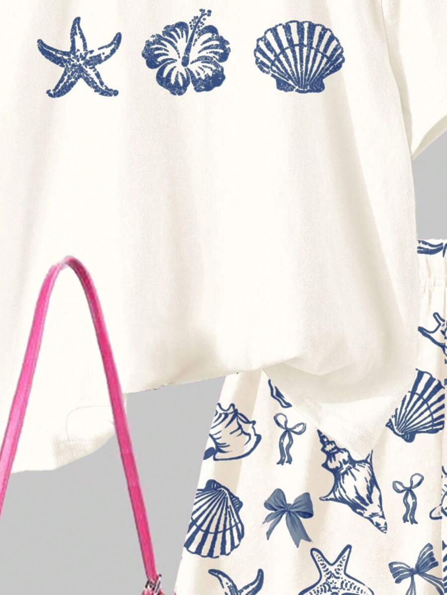 Tween girls 2-piece summer casual outfit featuring a multicolor seashell print short sleeve T-shirt with drop shoulders and matching loose fit shorts with pockets.