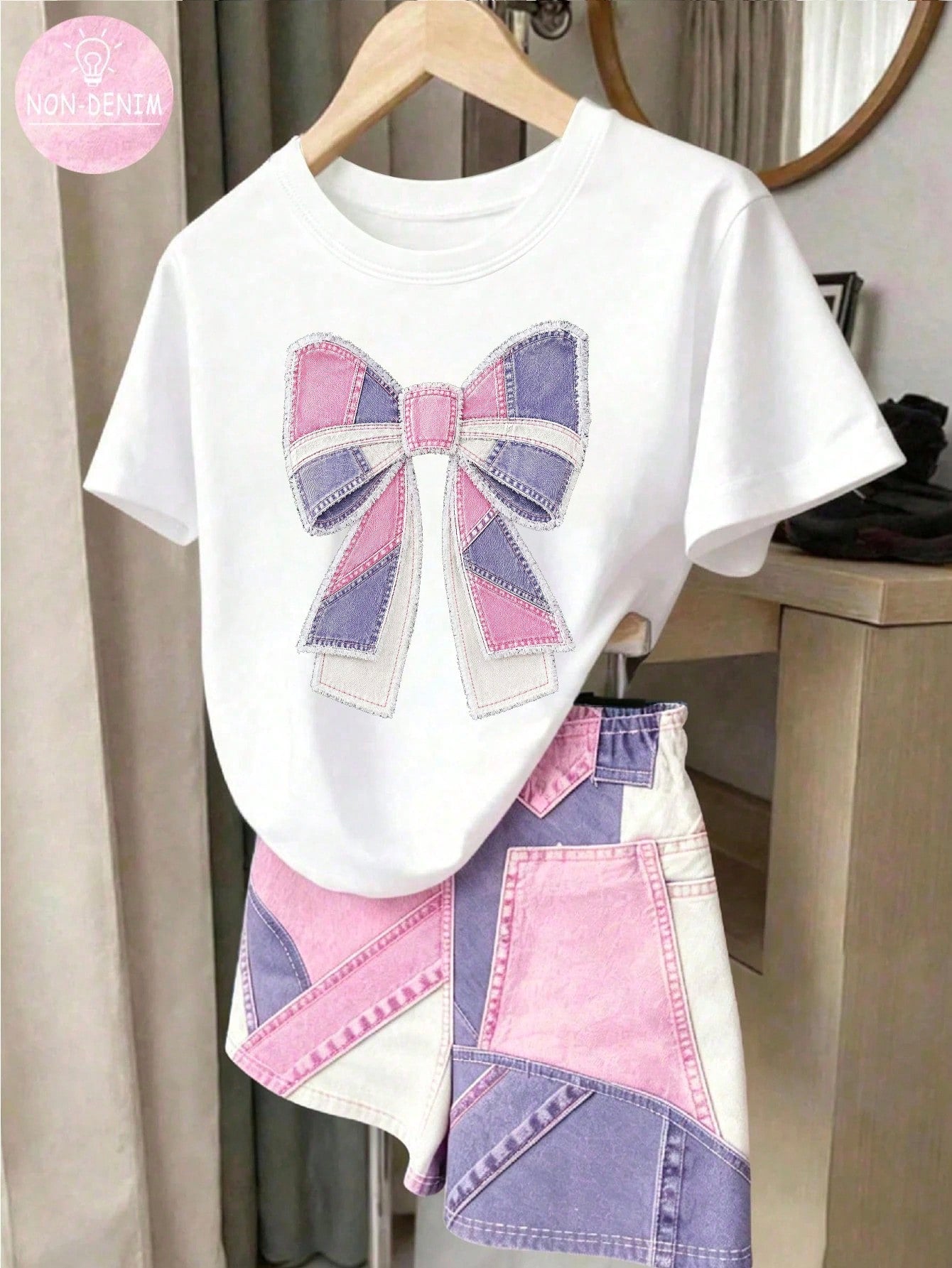 Tween girls two-piece green summer outfit featuring a fruit print short sleeve round neck t-shirt and matching track shorts with pockets.