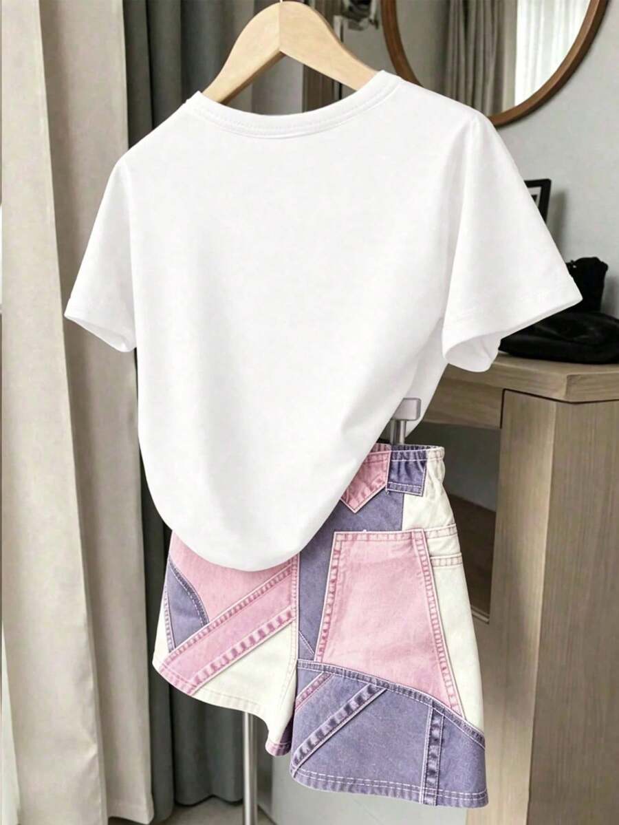 Tween girls two-piece green summer outfit featuring a fruit print short sleeve round neck t-shirt and matching track shorts with pockets.