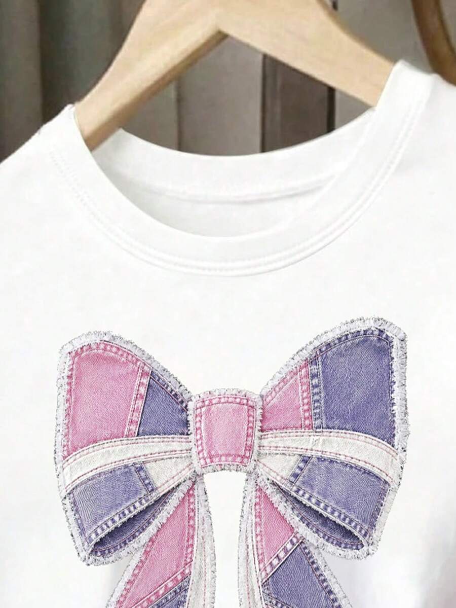 Tween girls two-piece green summer outfit featuring a fruit print short sleeve round neck t-shirt and matching track shorts with pockets.