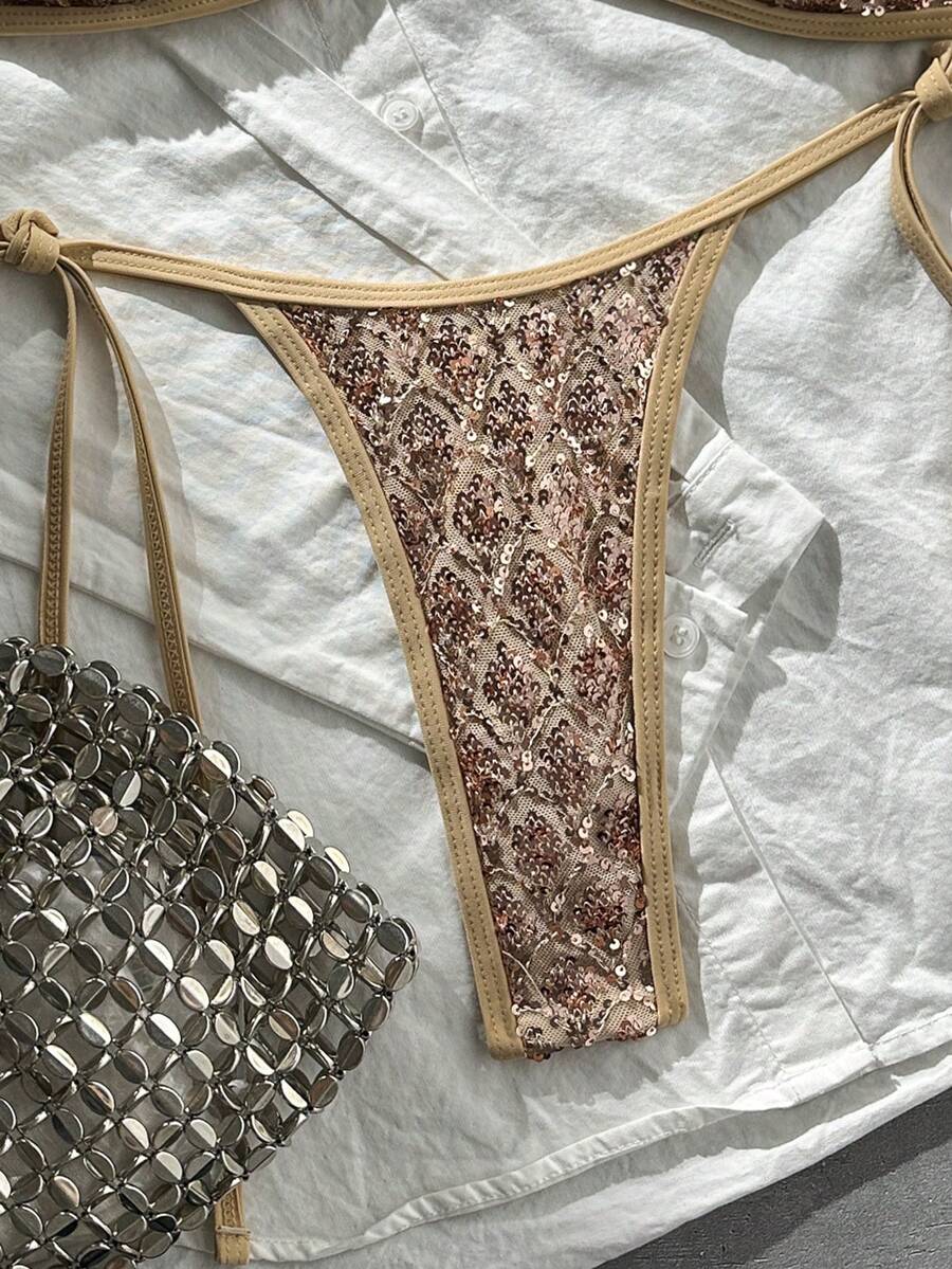 Apricot 2-piece sequin textured halter bikini set featuring a wireless top with lace-up backless ties and matching low-waist side-tie thong bottoms.