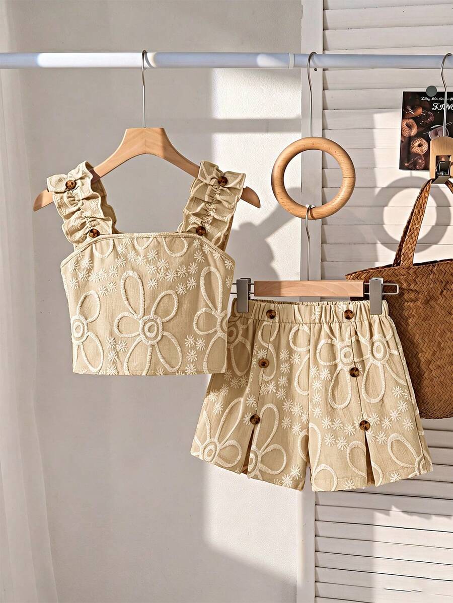 Apricot two-piece summer outfit for tween girls featuring a sleeveless pleated square-neck camisole top with button details and matching gathered shorts.