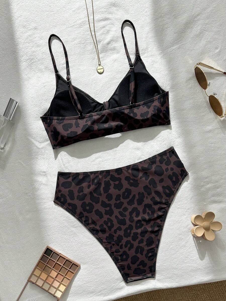 Women's black 2-piece high waist bikini swimsuit set featuring spaghetti straps, criss-cross knot details, wireless bra with removable padding, and high-stretch fabric.