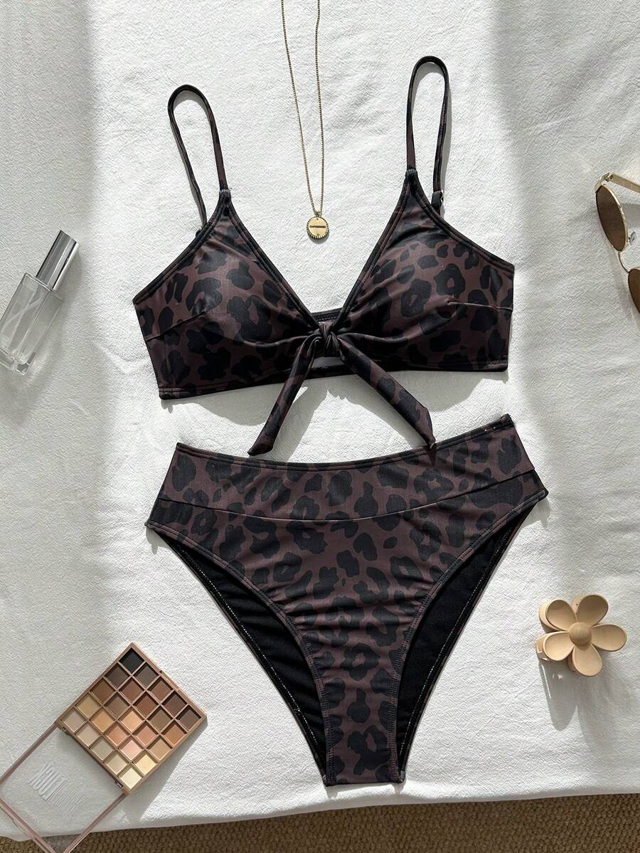 Women's black 2-piece high waist bikini swimsuit set featuring spaghetti straps, criss-cross knot details, wireless bra with removable padding, and high-stretch fabric.
