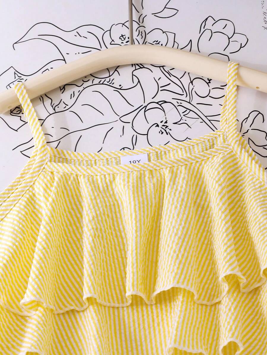 Tween girls blue 2-piece vacation outfit set featuring a tiered ruffle spaghetti strap camisole and loose high-waist pants.