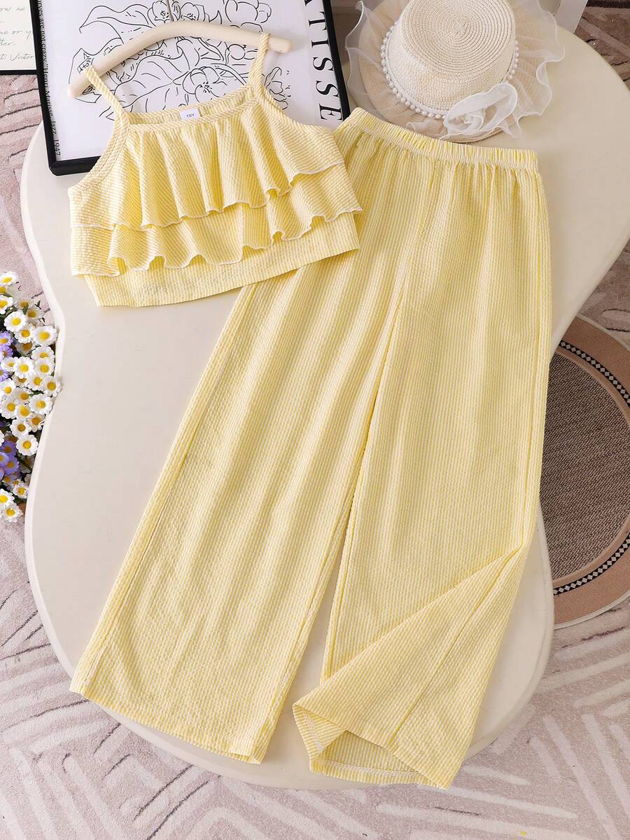 Tween girls blue 2-piece vacation outfit set featuring a tiered ruffle spaghetti strap camisole and loose high-waist pants.