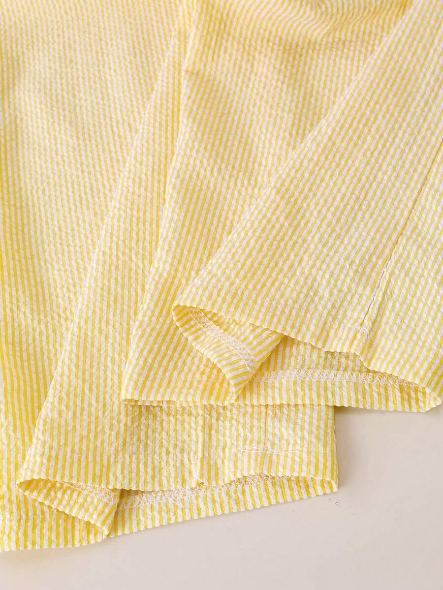 Tween girls blue 2-piece vacation outfit set featuring a tiered ruffle spaghetti strap camisole and loose high-waist pants.