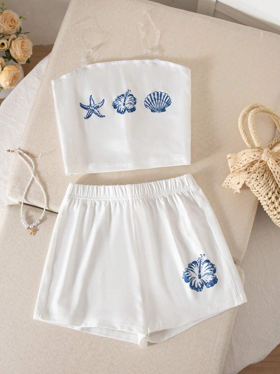 Tween girls summer 2-piece Hawaiian style outfit featuring a graphic print spaghetti strap camisole top with contrast piping and matching casual shorts.