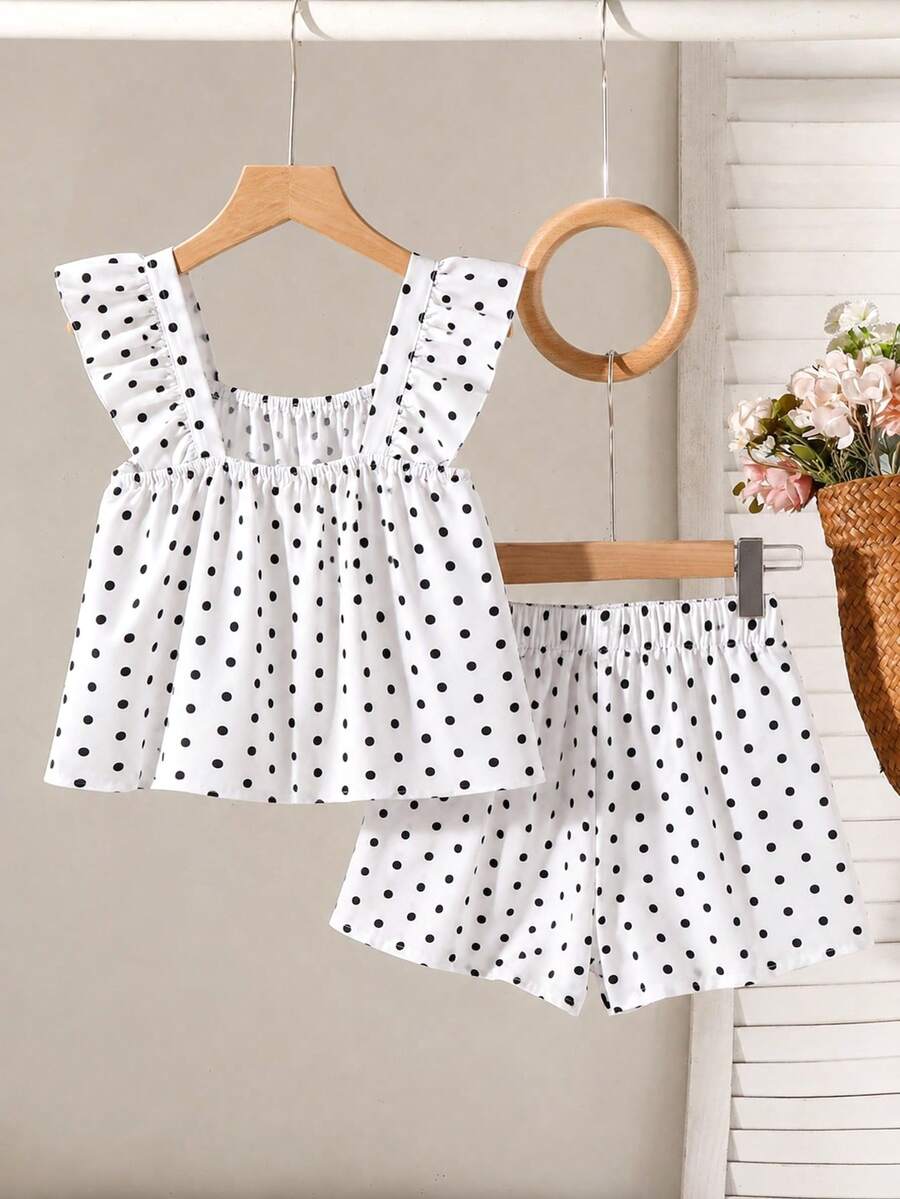 Tween girls 2-piece bohemian outfit set in apricot featuring a square neck embroidered sleeveless camisole top and matching floral wide leg shorts.