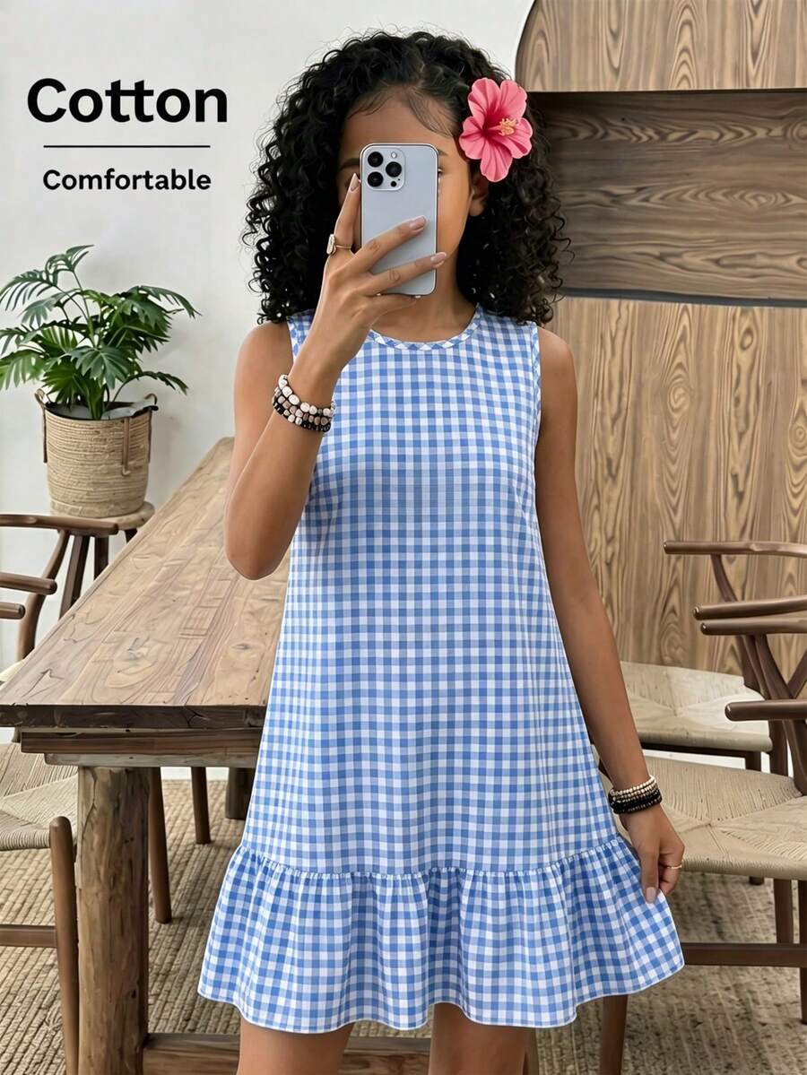 Tween girls casual leopard print smock mini dress featuring a round neck and flounce ruffle hem.