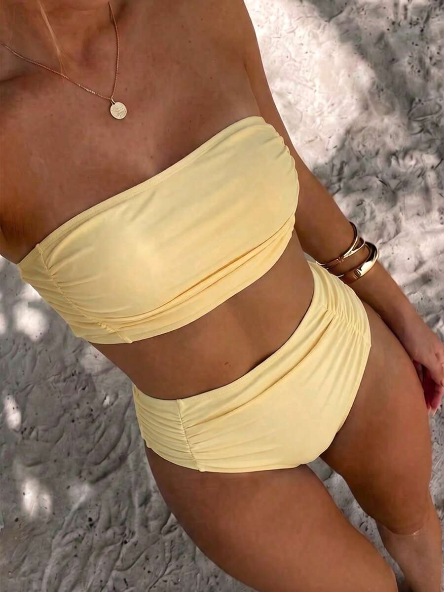 Women's black strapless ruched bandeau bikini top with high waisted bottoms