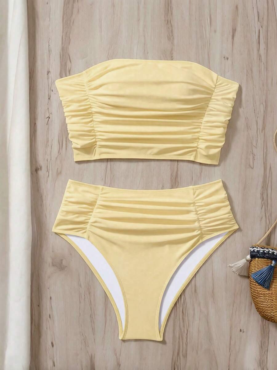 Women's black strapless ruched bandeau bikini top with high waisted bottoms