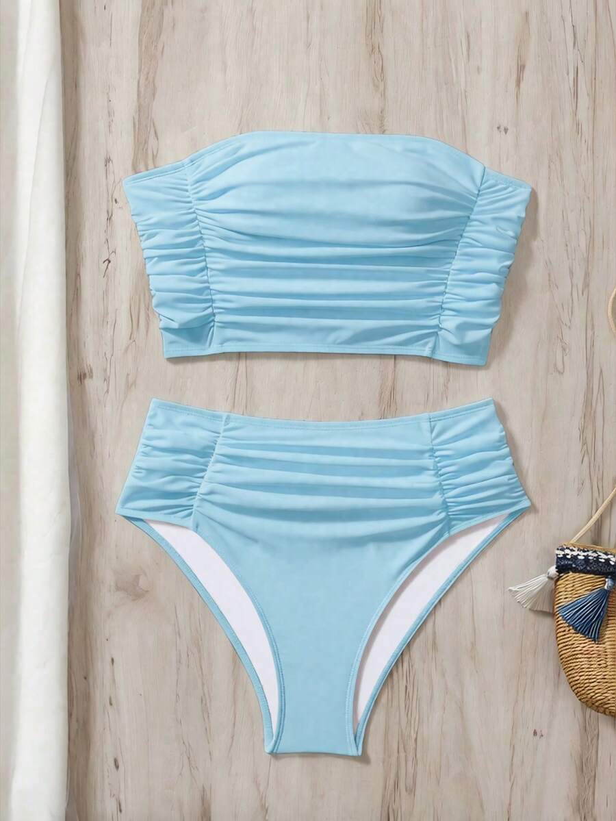 Women's black strapless ruched bandeau bikini top with high waisted bottoms