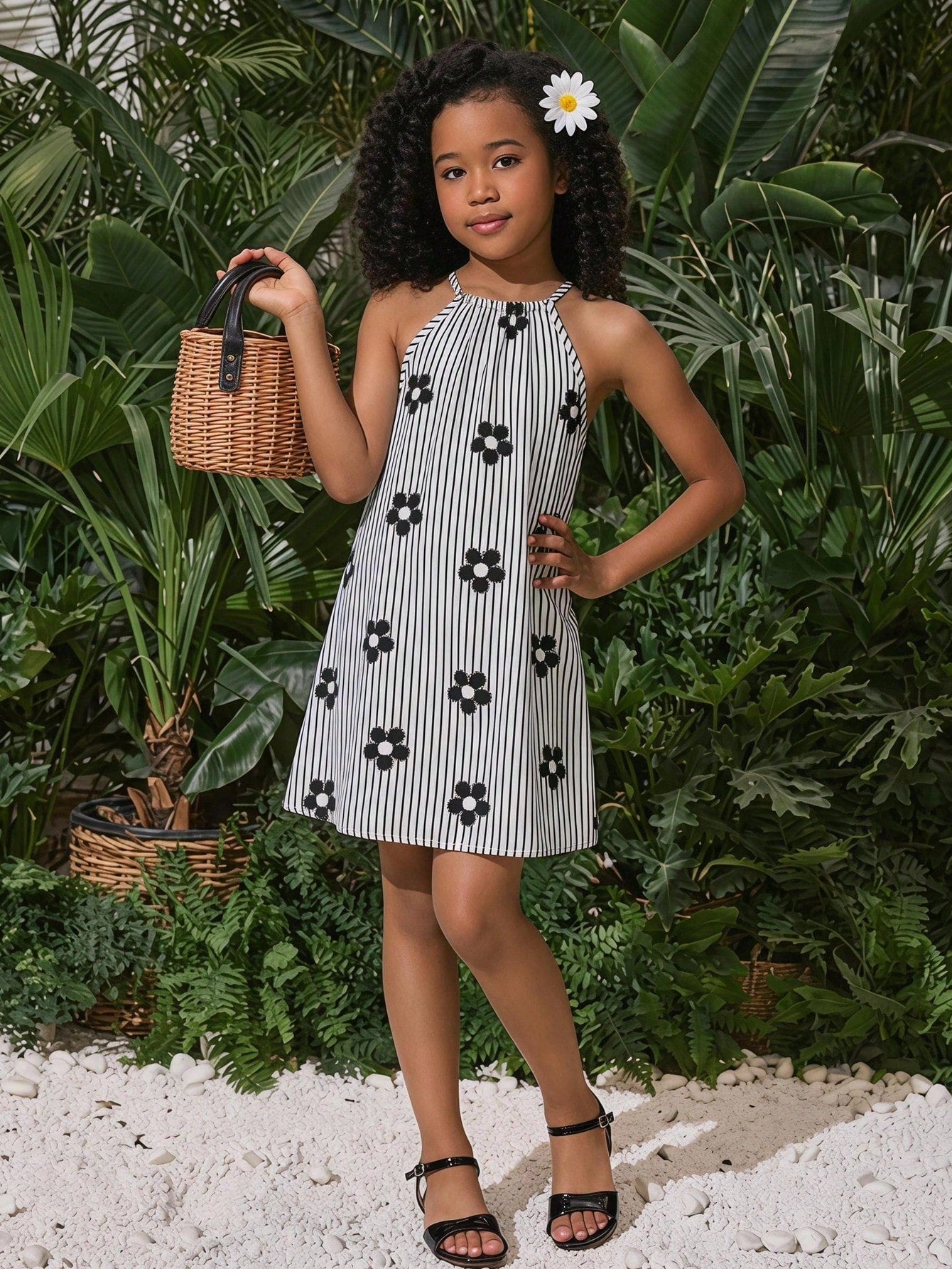 Tween girls floral print dress with halter neckline, sleeveless cold shoulder design, A-line shape, and vacation style.