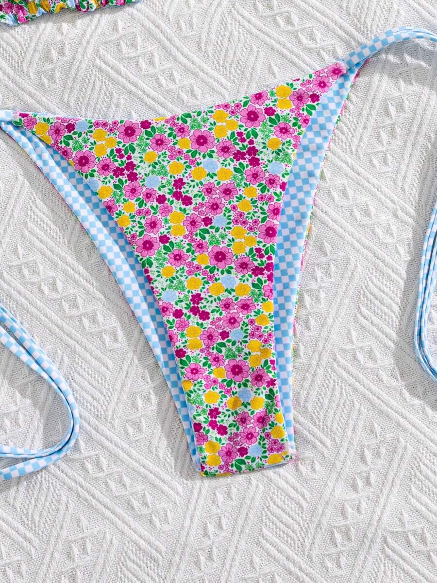 Multicolor striped halter neck two-piece bikini set featuring wireless triangle cups and low-waist tie-side bottoms.