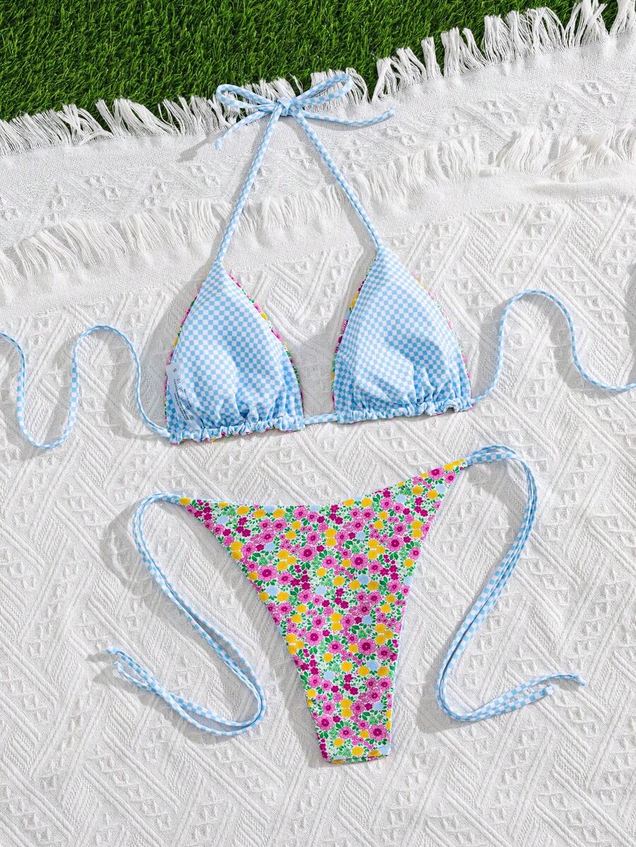 Multicolor striped halter neck two-piece bikini set featuring wireless triangle cups and low-waist tie-side bottoms.