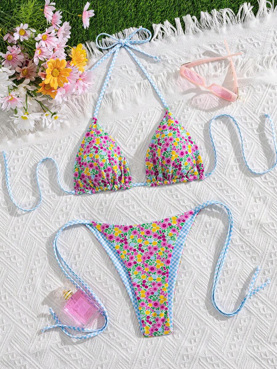 Multicolor striped halter neck two-piece bikini set featuring wireless triangle cups and low-waist tie-side bottoms.