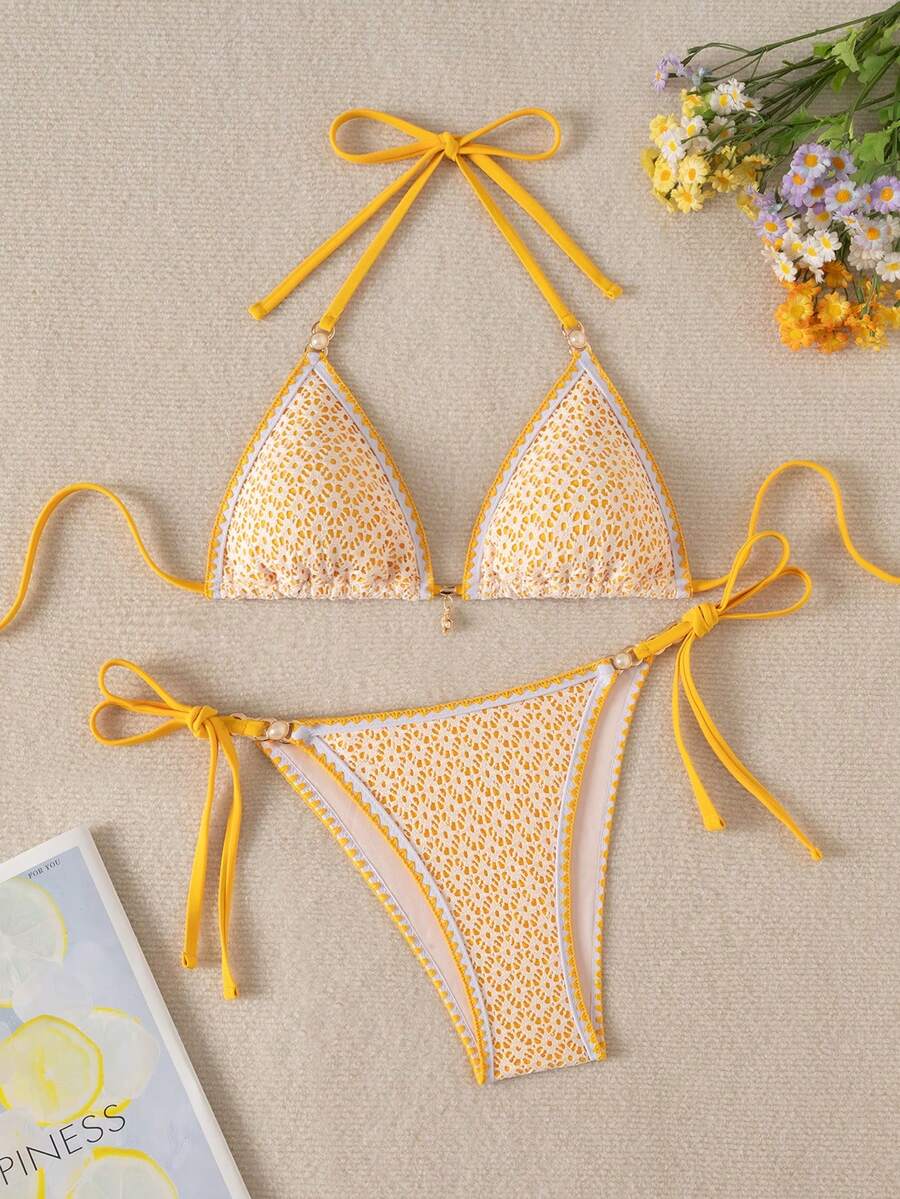 Women's triangle bikini set with contrast lace wireless bra top and ultra high waist tie side bottoms.
