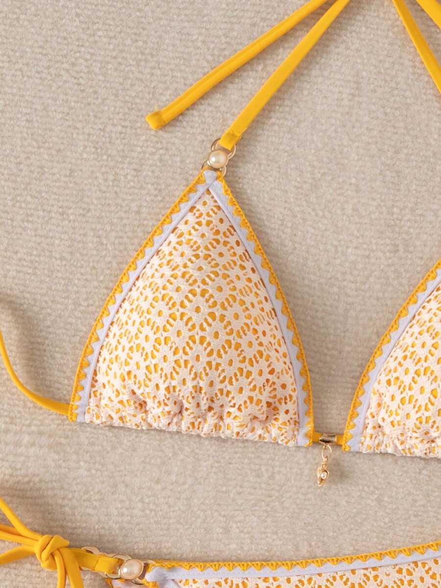 Women's triangle bikini set with contrast lace wireless bra top and ultra high waist tie side bottoms.
