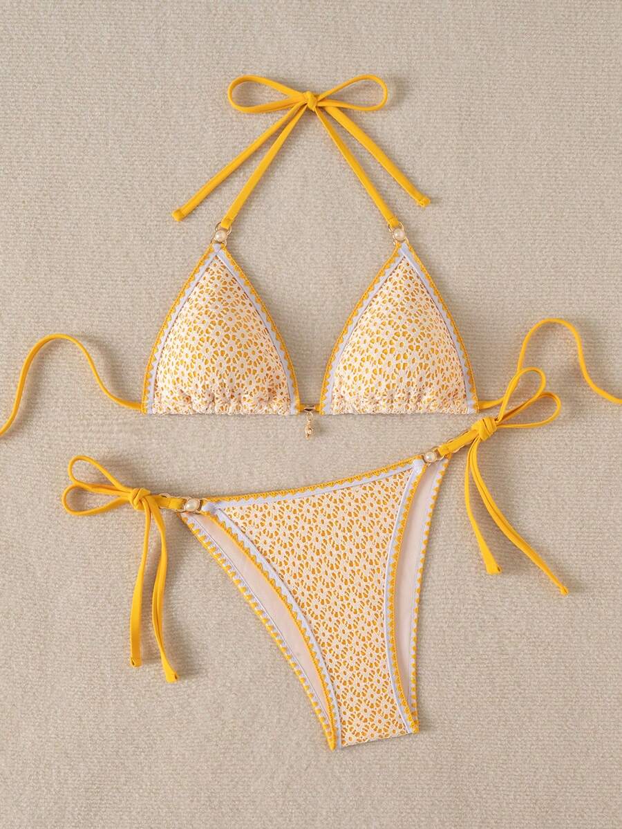 Women's triangle bikini set with contrast lace wireless bra top and ultra high waist tie side bottoms.