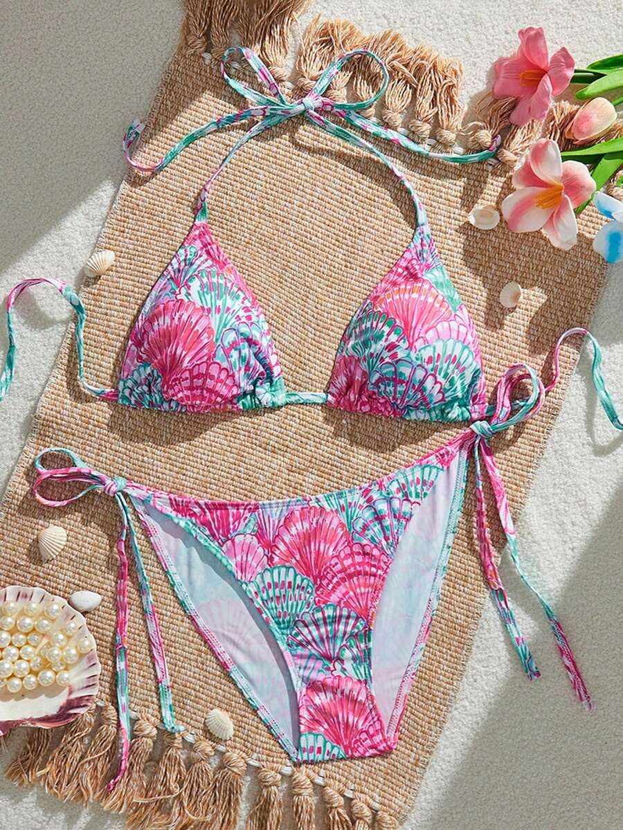 Women's black and white zebra print two-piece bikini set featuring a high waist tie-side bottom and a backless halter top with removable padding.
