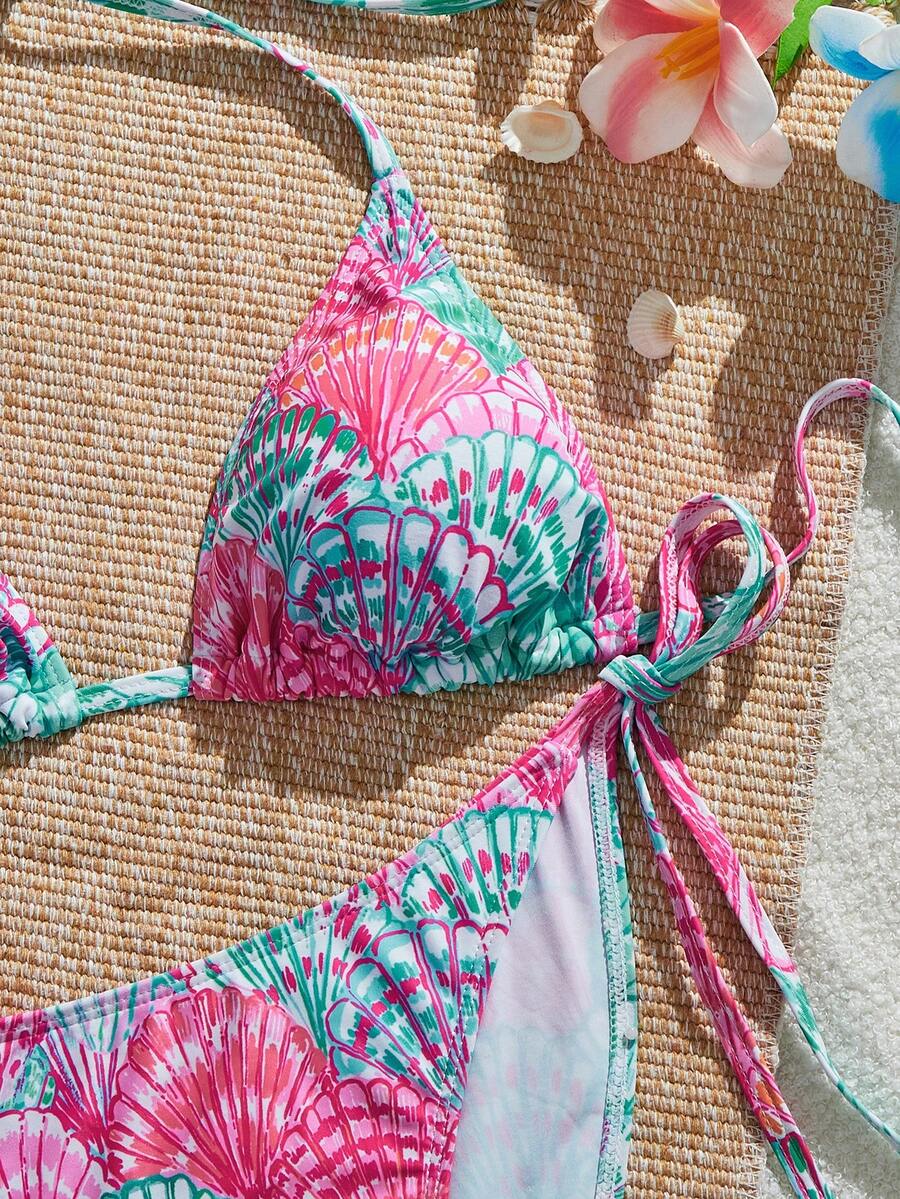 Women's black and white zebra print two-piece bikini set featuring a high waist tie-side bottom and a backless halter top with removable padding.