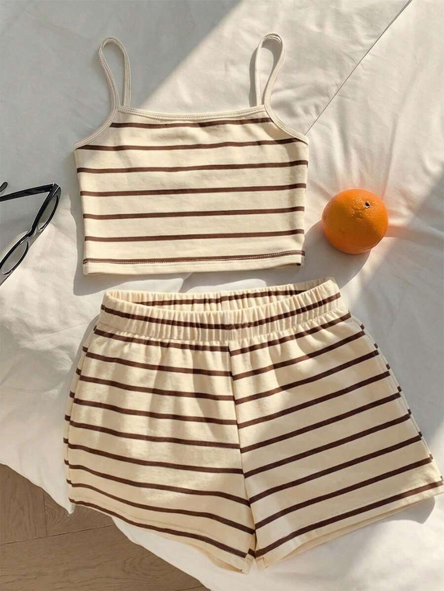 Tween girls summer 2-piece Hawaiian style outfit featuring a graphic print spaghetti strap camisole top with contrast piping and matching casual shorts.