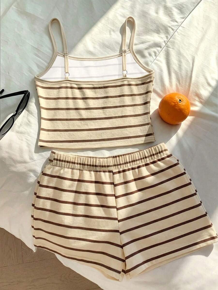 Tween girls summer 2-piece Hawaiian style outfit featuring a graphic print spaghetti strap camisole top with contrast piping and matching casual shorts.