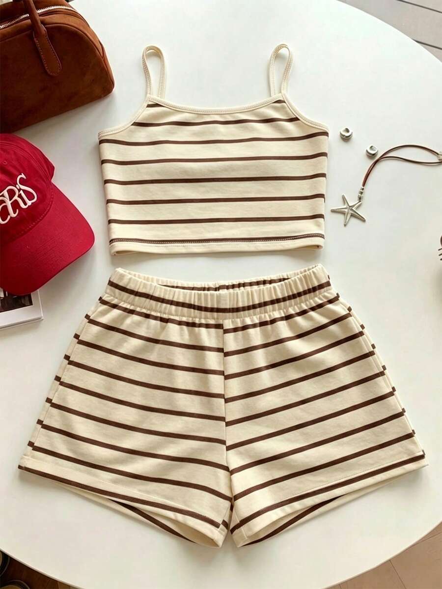 Tween girls summer 2-piece Hawaiian style outfit featuring a graphic print spaghetti strap camisole top with contrast piping and matching casual shorts.