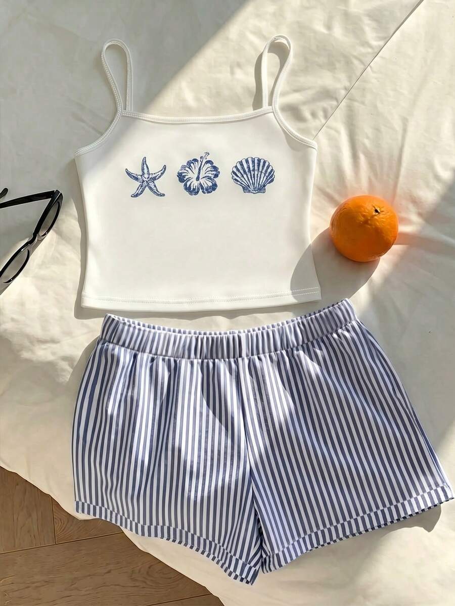 Tween girls summer 2-piece Hawaiian style outfit featuring a graphic print spaghetti strap camisole top with contrast piping and matching casual shorts.
