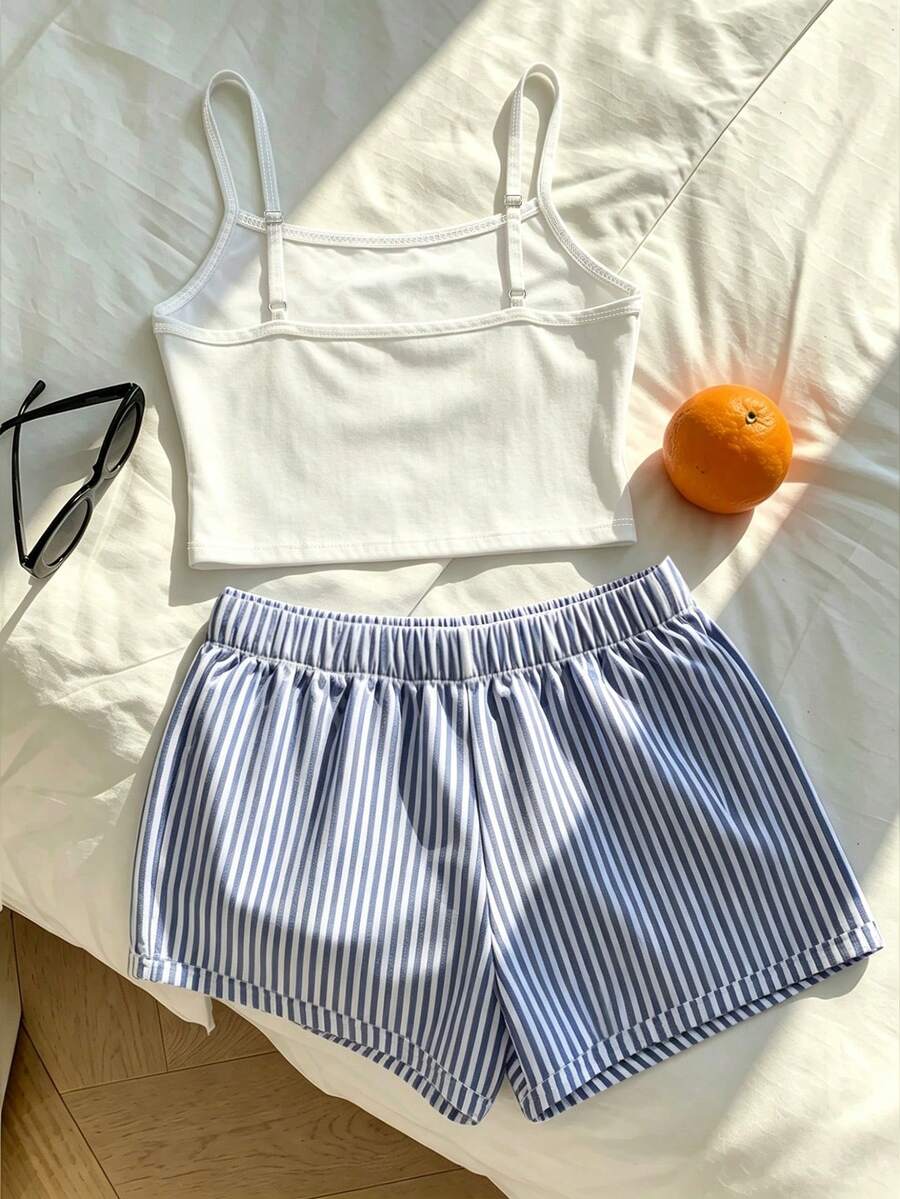 Tween girls summer 2-piece Hawaiian style outfit featuring a graphic print spaghetti strap camisole top with contrast piping and matching casual shorts.