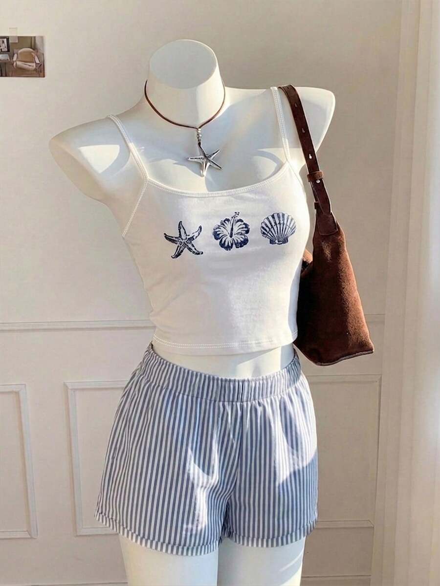 Tween girls summer 2-piece Hawaiian style outfit featuring a graphic print spaghetti strap camisole top with contrast piping and matching casual shorts.