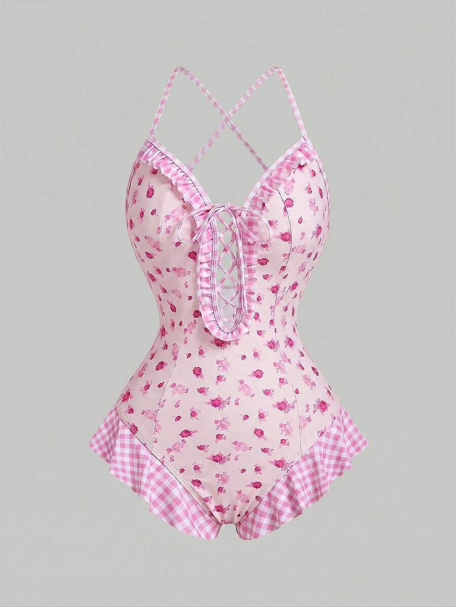 Women's strawberry print one-piece swimsuit featuring ruffle details, front-tie design, backless criss-cross straps, and triangle wireless cups.