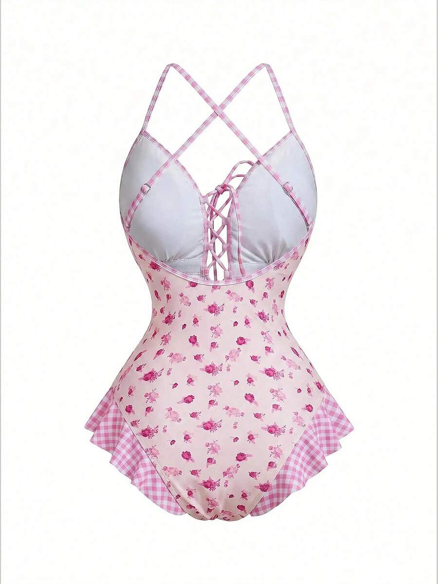 Women's strawberry print one-piece swimsuit featuring ruffle details, front-tie design, backless criss-cross straps, and triangle wireless cups.