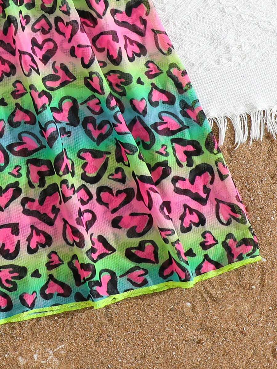 Multicolor heart print long cover up dress for tween girls featuring a V-neck criss-cross wrap front and short sleeves.
