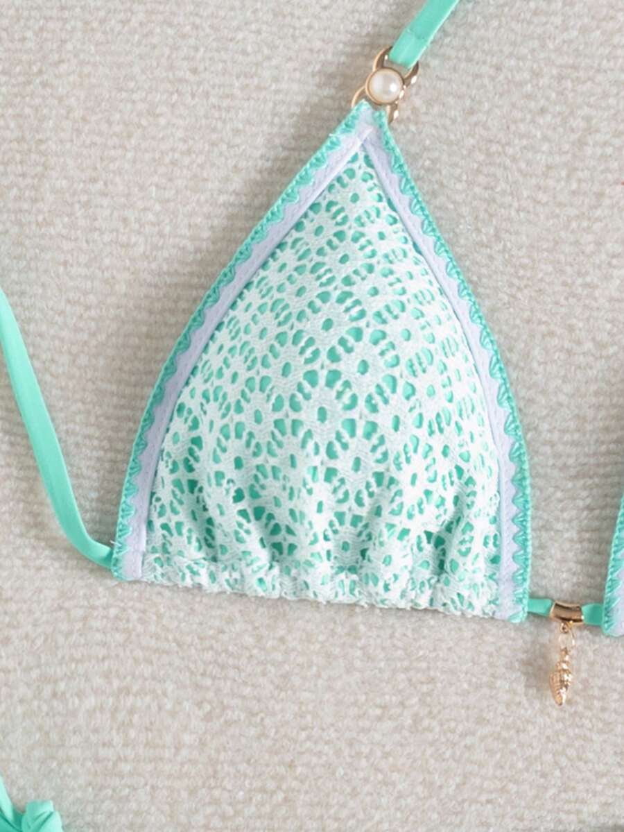 Women's triangle bikini set with contrast lace wireless bra top and ultra high waist tie side bottoms.