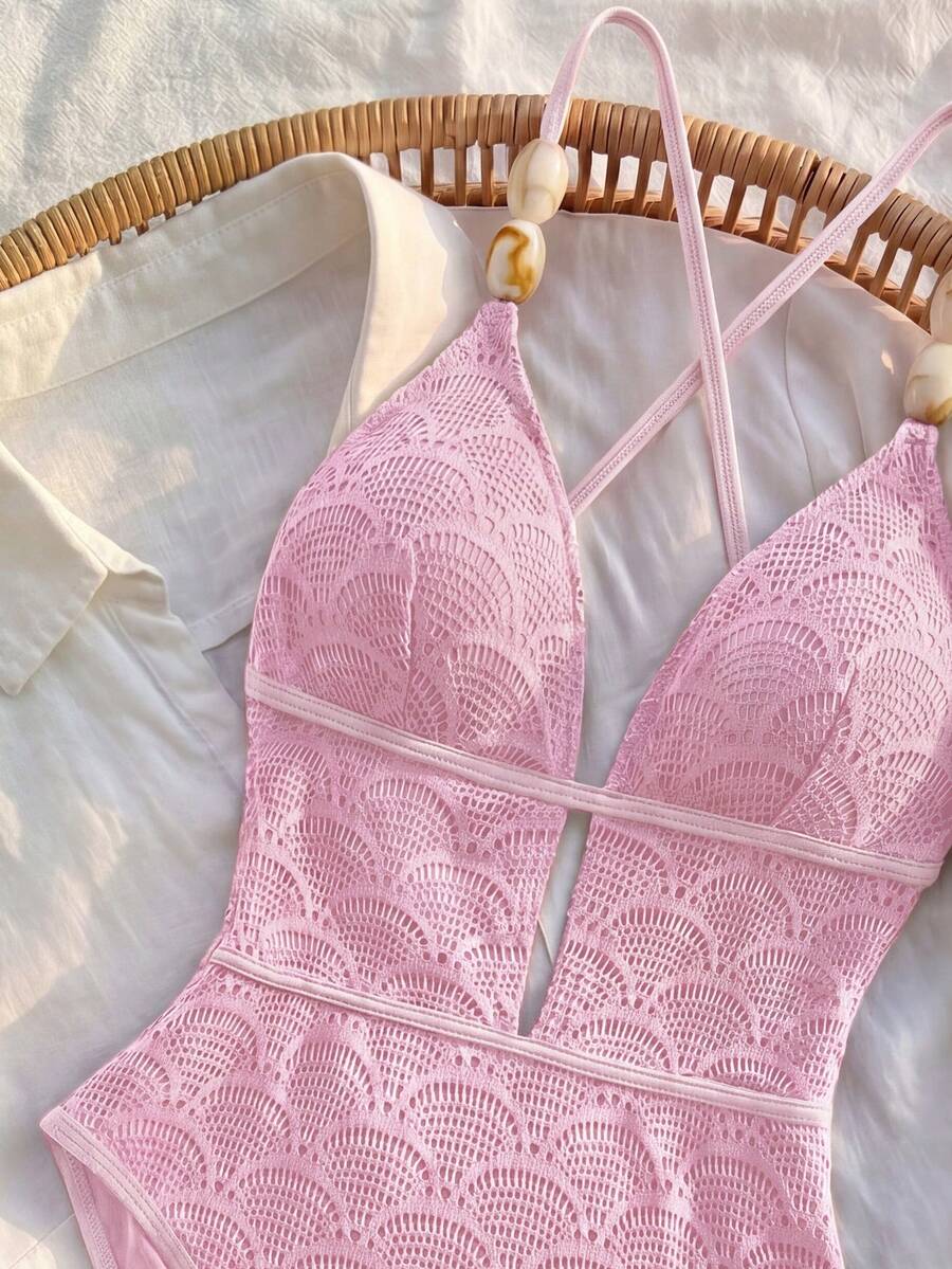 Women's fresh green boho one-piece swimsuit featuring a lace-up V-neckline, textured stretch fabric, and sleeveless design for beach and vacation wear.
