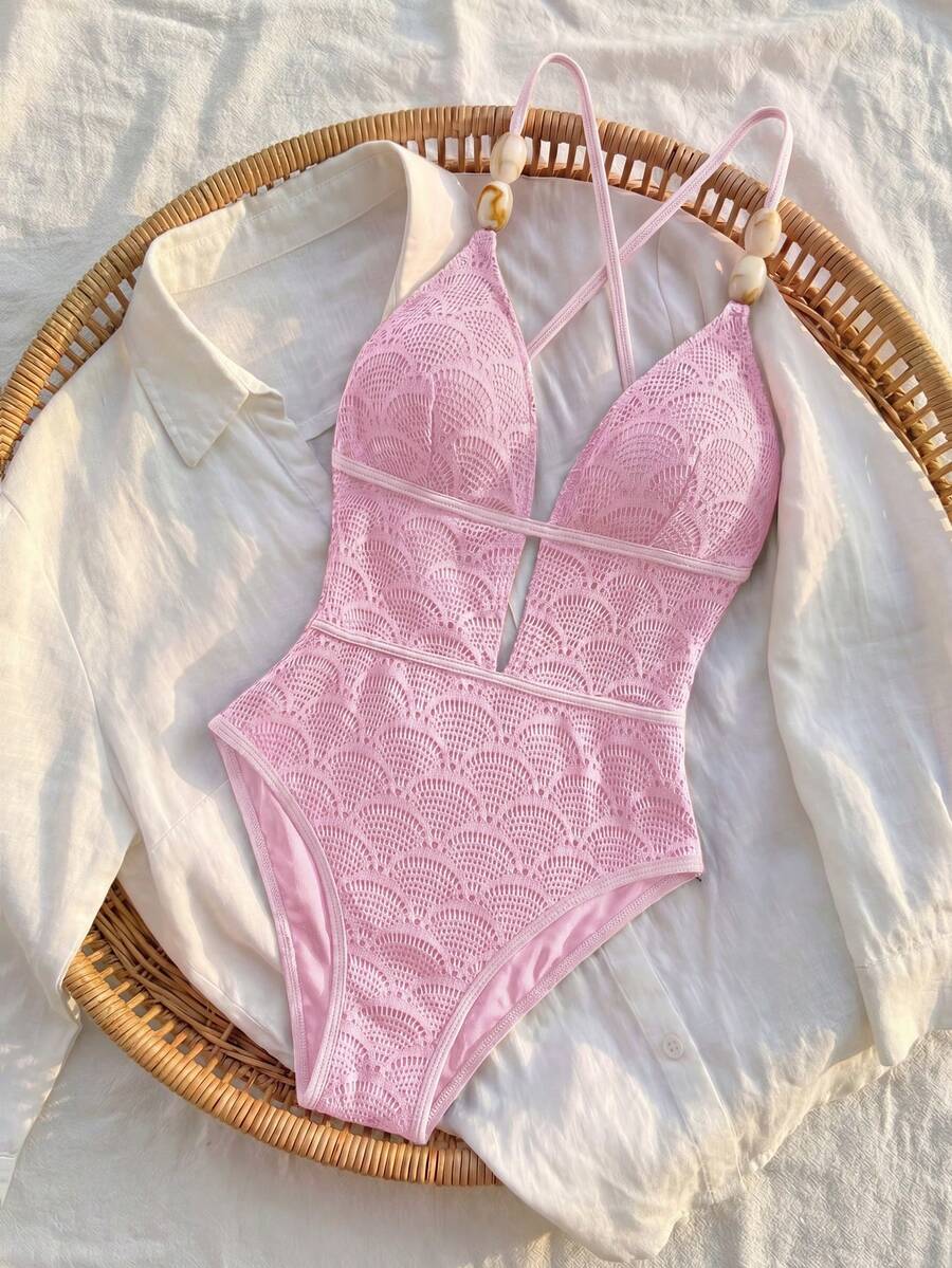 Women's fresh green boho one-piece swimsuit featuring a lace-up V-neckline, textured stretch fabric, and sleeveless design for beach and vacation wear.