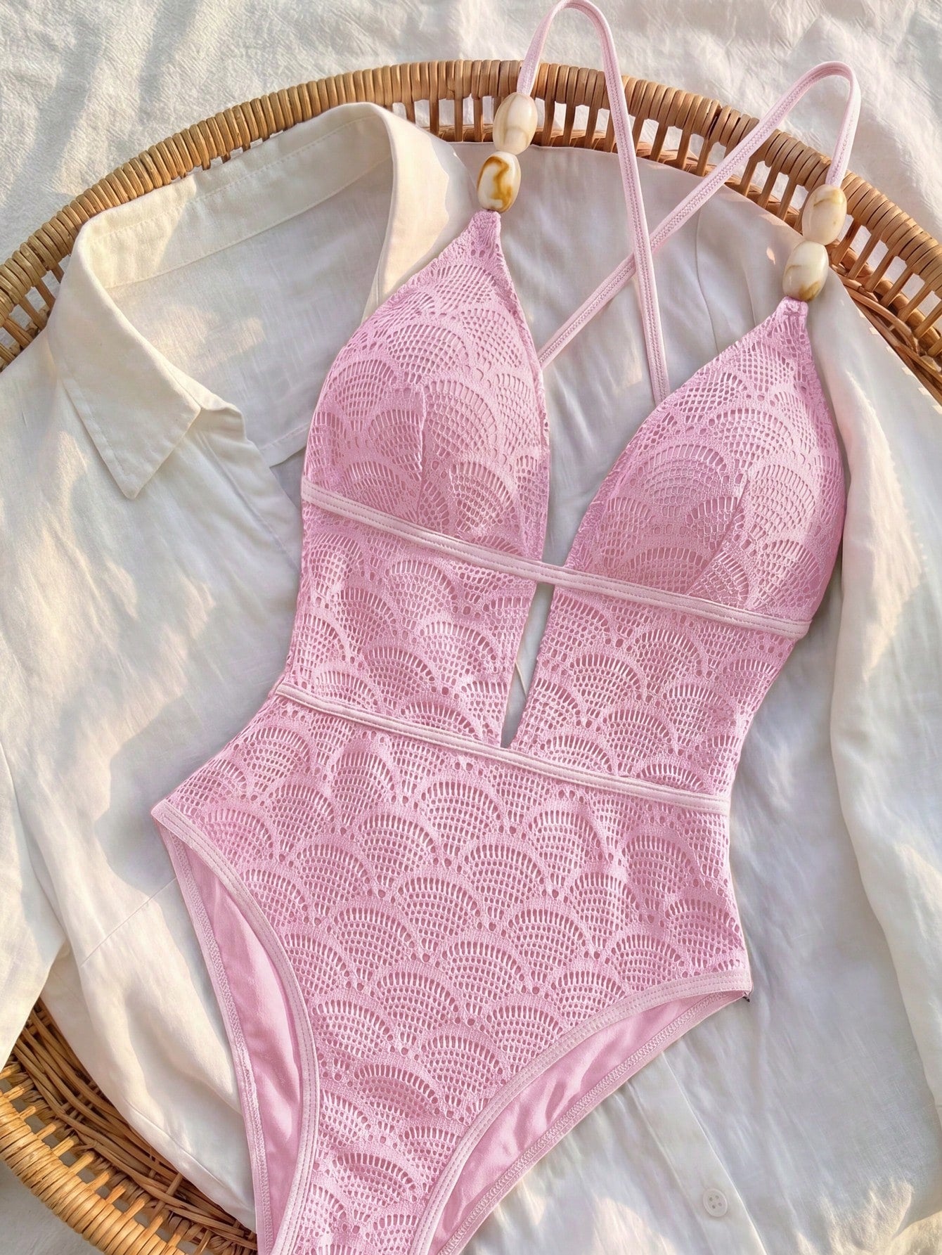Women's fresh green boho one-piece swimsuit featuring a lace-up V-neckline, textured stretch fabric, and sleeveless design for beach and vacation wear.