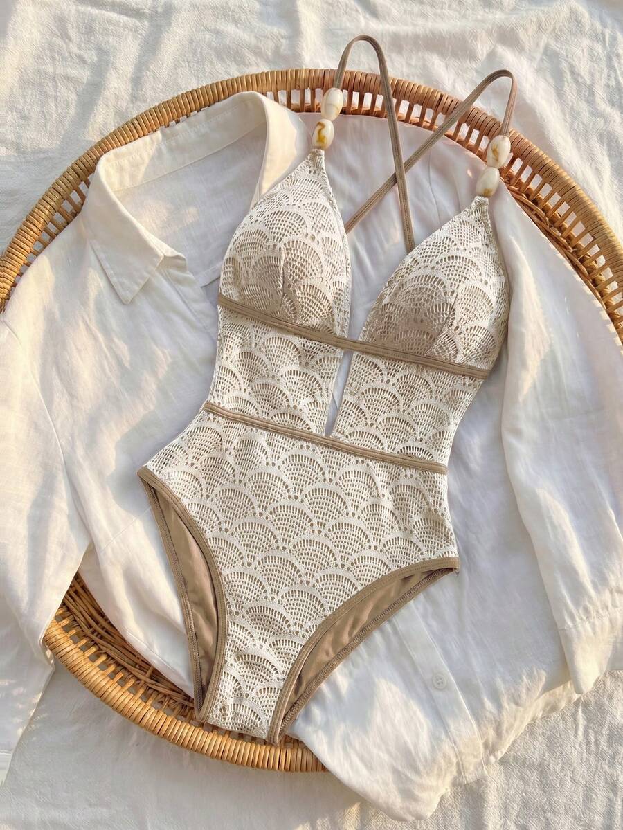 Women's fresh green boho one-piece swimsuit featuring a lace-up V-neckline, textured stretch fabric, and sleeveless design for beach and vacation wear.