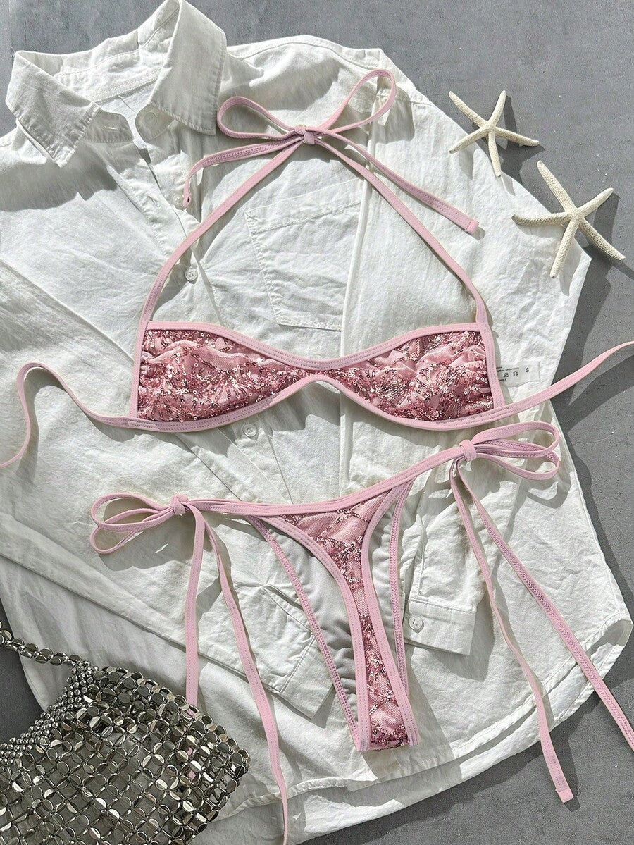 Apricot 2-piece sequin textured halter bikini set featuring a wireless top with lace-up backless ties and matching low-waist side-tie thong bottoms.