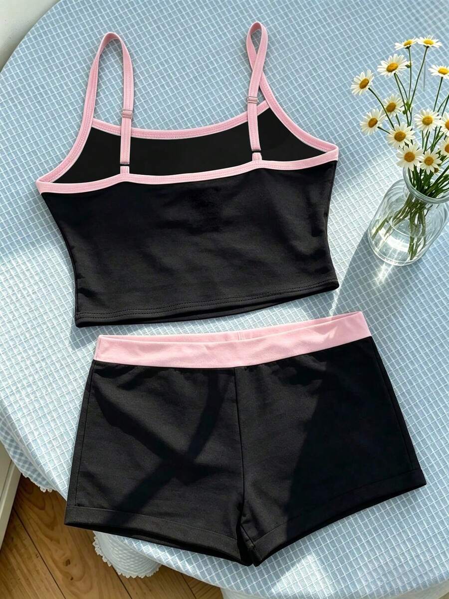 Tween girls summer 2-piece Hawaiian style outfit featuring a graphic print spaghetti strap camisole top with contrast piping and matching casual shorts.