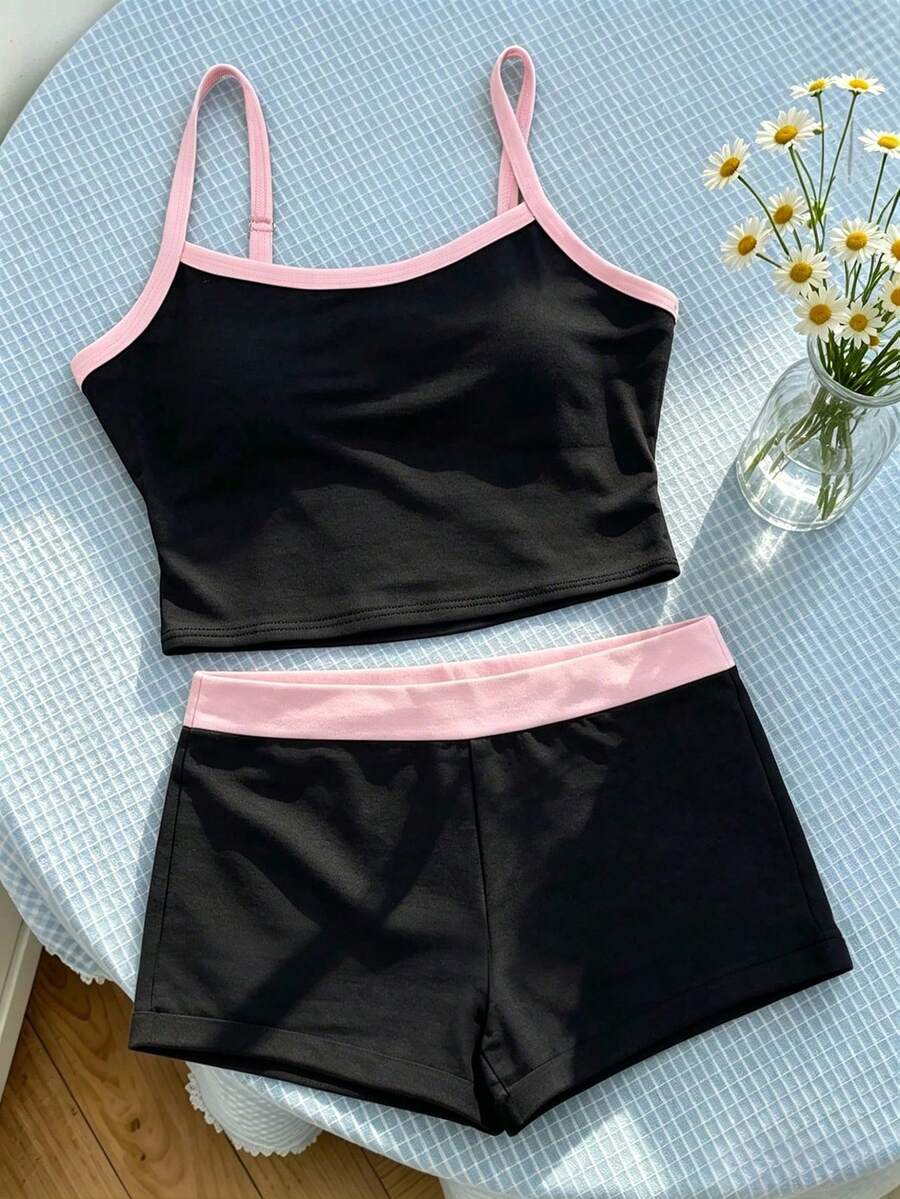 Tween girls summer 2-piece Hawaiian style outfit featuring a graphic print spaghetti strap camisole top with contrast piping and matching casual shorts.