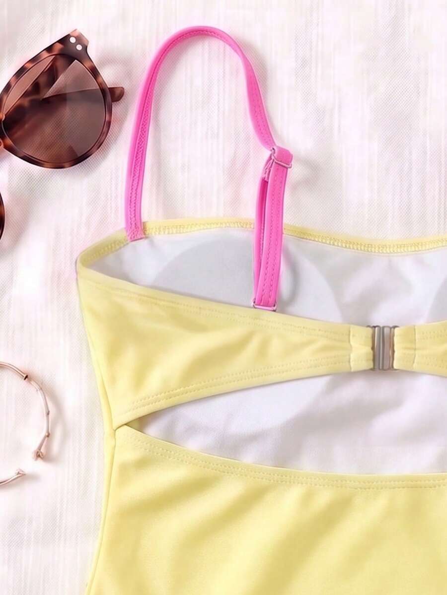 Black colorblock women's one-piece swimsuit with spaghetti straps and high stretch fabric.