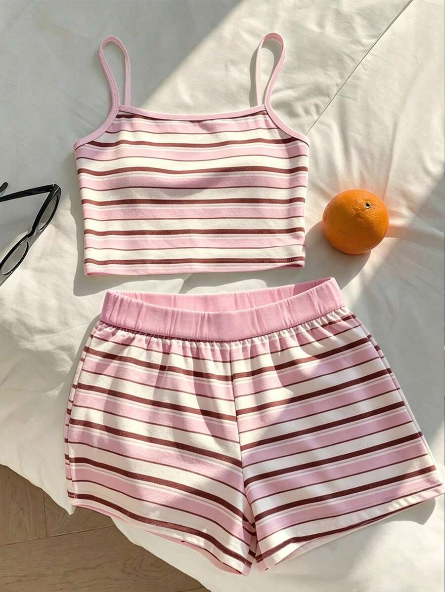 Tween girls summer 2-piece Hawaiian style outfit featuring a graphic print spaghetti strap camisole top with contrast piping and matching casual shorts.