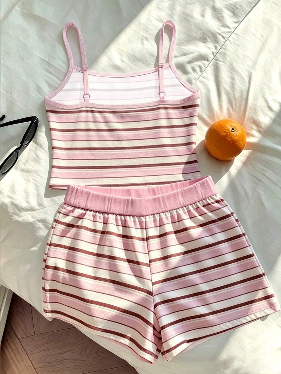 Tween girls summer 2-piece Hawaiian style outfit featuring a graphic print spaghetti strap camisole top with contrast piping and matching casual shorts.