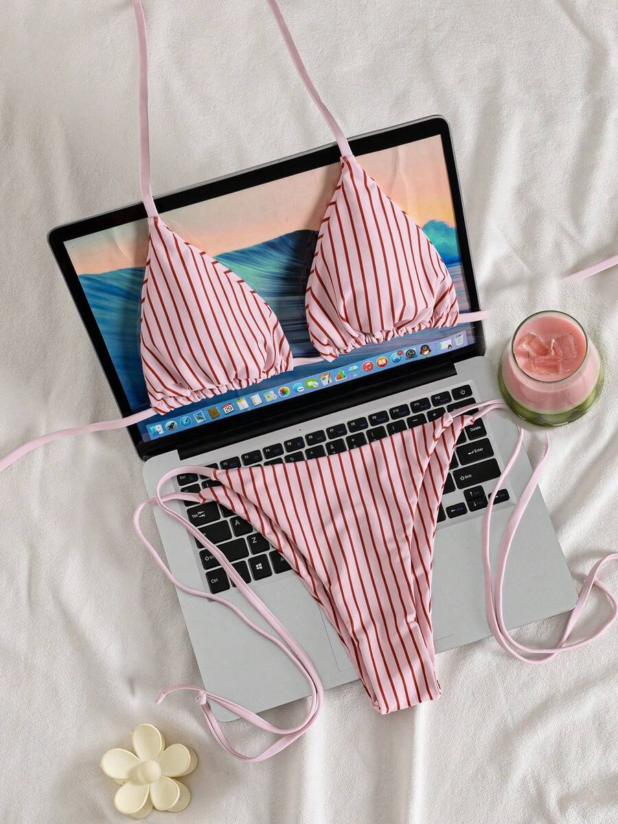 Multicolor striped halter neck two-piece bikini set featuring wireless triangle cups and low-waist tie-side bottoms.