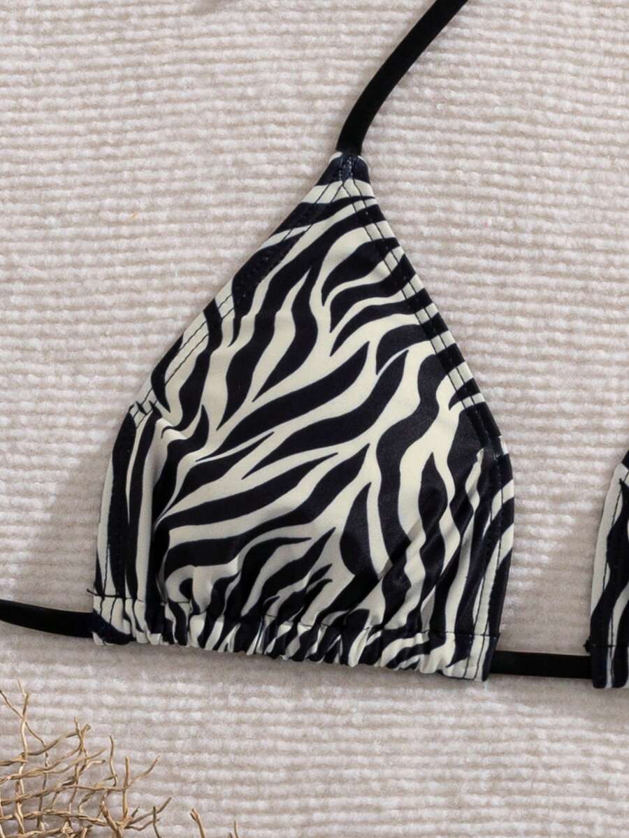 Women's 2-piece halter bikini set featuring geometric print, triangle cups with removable padding, and side tie bikini bottoms